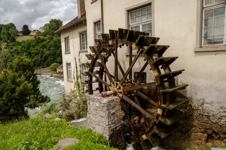 Water wheel in the old town of RhineFalls Switzerlandの写真素材