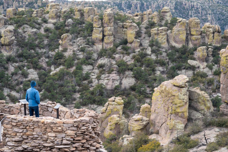 Arizona, USA - December 19, 2023: Hiker enjoys the view at Massai Nature Trail -  Chiricahua National Monument Arizonaの写真素材