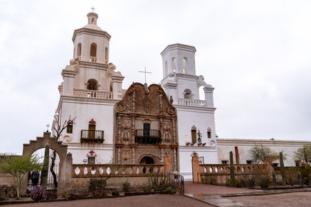 San Xavier del Bac Mission, Tohono O'odham Reservation, Tucson in Pima County, Arizona, on a cloudy dayのeditorial素材