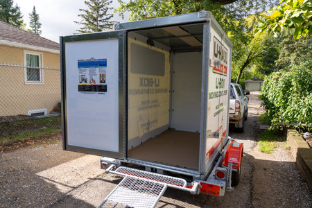 New Hope, Minnesota - October 14, 2023: U-Haul Ubox container pod, in a driveway, empty, ready for...