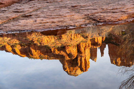 Cathedral Rock sunset at Oak Creek with reflection. Sedona, Arizona in winterの写真素材
