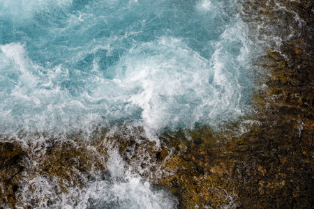 Abstract view of rushing current of the Bruarfoss Waterfall in Iceland, useful for backgroundsの写真素材