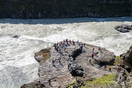 Gullfoss, Iceland - July 9, 2023: Tourists view Gullfoss waterfall from water-level at a viewing...