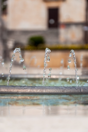 Fountain pipe with water in Makarska, Croatia の写真素材