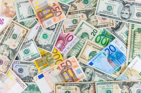 Background made of dollar and euro banknotes の写真素材