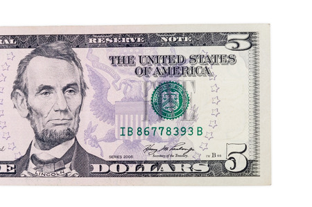 Part of five dollars banknote isolated on white background with clipping pathの写真素材