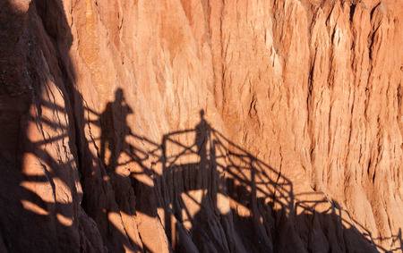 Shadows of people taking pictures on the cliffsの写真素材