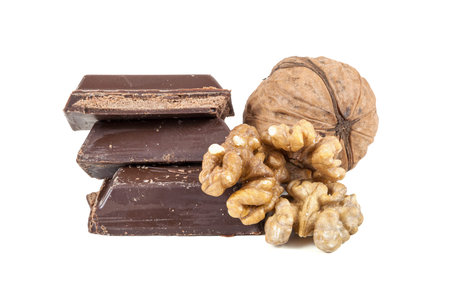 Chocolate pieces and walnuts isolated on white background with clipping path