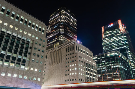 LONDON, UNITED KINGDOM - NOVEMBER 10, 2014: Night view of modern skyscrapers in Canary Wharf. The view includes Citi HQ and One Canada Square building.のeditorial素材