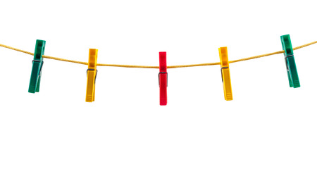 Colorful clothes pegs on a rope isolated on white background with clipping pathの写真素材