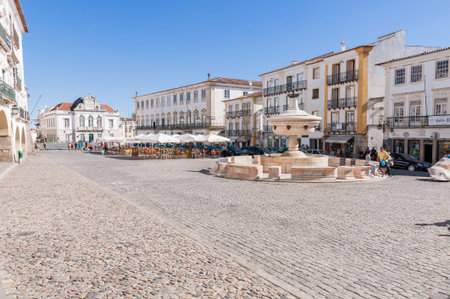 EVORA, PORTUGAL - AUGUST 25, 2014: Giraldo Square in the center of Evora with renaissance fountain...
