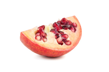 Piece of fresh pomegranate fruits isolated on white background with clipping pathのeditorial素材