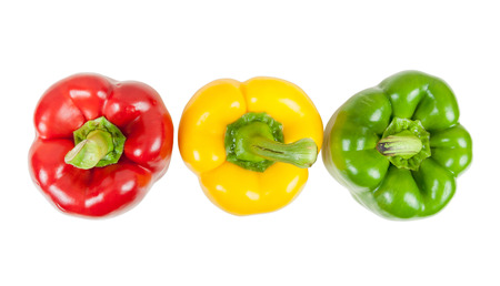 Top view of  three colored peppers isolated on white background with clipping pathの写真素材