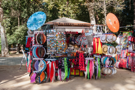 SEVILLE, SPAIN - AUGUST 28, 2015:  Typical spanish souvenir stall in Seville sells colorful little things.のeditorial素材