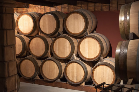 Wooden barrels for wine in the cellarの写真素材