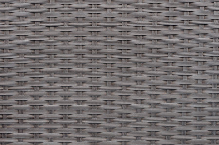 Background or texture made of woven plastic wicker pattern