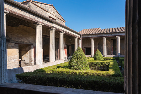 Small green courtyard of the house in Pompeii, the ancient Roman city destroyed during a catastrophic eruption of the volcano Mount Vesuvius in 79 ADの写真素材