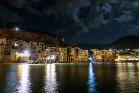 View of coast in Cefalu town on Sicily by night, Italyの写真素材