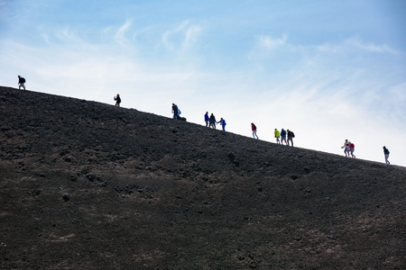 Etna, Sicily, Italy - August 21, 2017: People walk around the crater of Mount Etna, most active volcano in Europeのeditorial素材