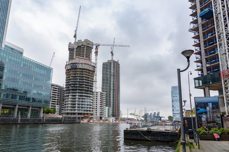 London, UK - April 28, 2018: Construction site of new skyscrapers at South Dock in Canary Wharfのeditorial素材