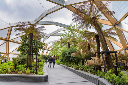 London, UK - April 28, 2018: Tourists visit the roof garden at Crossrail Place in Canary Wharfのeditorial素材