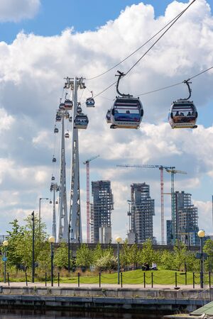 London, UK - May 1, 2018: Gondolas of Emirates Air Line depart from station at Royal Victoria Dock in eastern Londonのeditorial素材