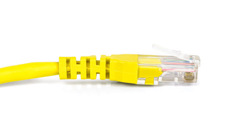 Yellow network plug isolated on white background