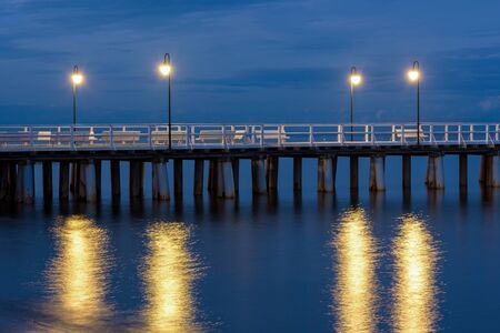 Evening view of wooden pier in Gdynia Orlowo in Polandの写真素材