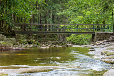 Bridge over the Mumlava river near Harrachov in Czech Giant Mountainsの写真素材