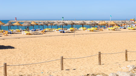 Sandy beach at Atlantic Ocean in Vilamoura, Algarve, Portugalの写真素材