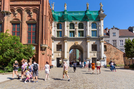 Gdansk, Poland - June 14, 2020: People enter the old city of Gdansk through the Golden Gate