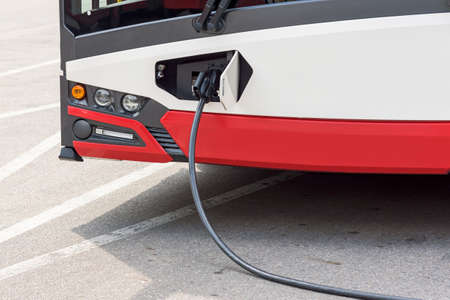 Closeup of electric bus of public transport at the charging stationの写真素材