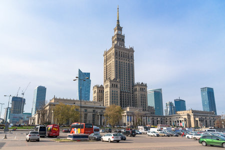 Warsaw, Poland - October 19, 2019: Cars parked in front of Palace of Culture and Science. Modern...