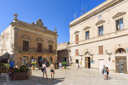 Erice, Sicily, Italy - August 25, 2017: Tourists visit Piazza della Loggia in the ancient town of Ericeのeditorial素材