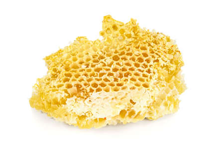 Piece of honeycomb isolated on white background with clipping pathの写真素材