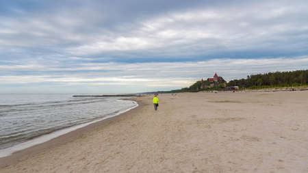 Afternoon view of beach with historic hotel building in Leba at Baltic sea in Polandのeditorial素材