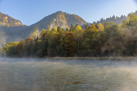 View of the Dunajec river at misty autumn morning in Sromowce Nizne. Pieniny mountains, Polandの写真素材