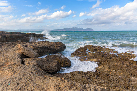 Waves crashing on the rocky coast of northern Mallorcaの写真素材
