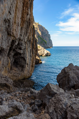Nestled between dramatic cliffs and sparkling turquoise waters, the serene bay of Sa Calobra on the island of Mallorca, Spain, offers a perfect Mediterranean retreat for yachts and nature lovers.の写真素材