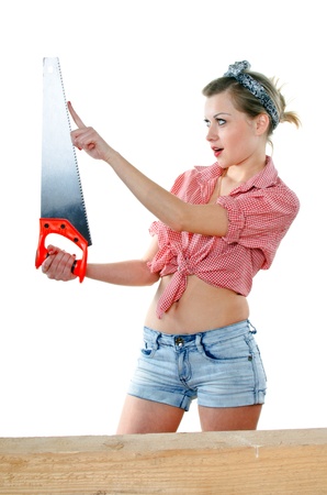 young woman with a saw on a white backgroundの写真素材