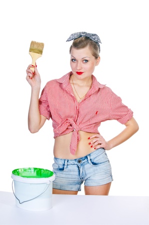 woman with brush and green paint on whiteの写真素材