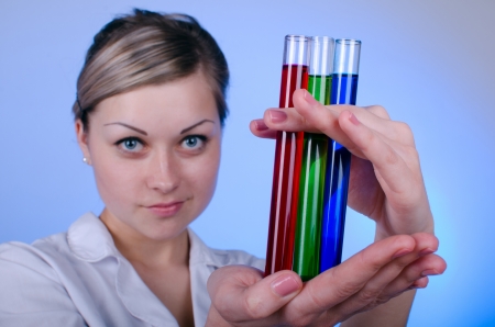 Girl researcher working with the test tubes RGBの写真素材