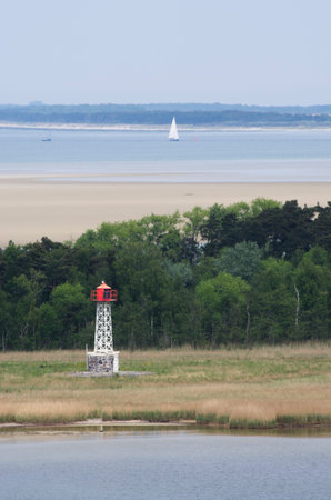 Lighthouse in landscape at the Baltic Sea shoreの写真素材