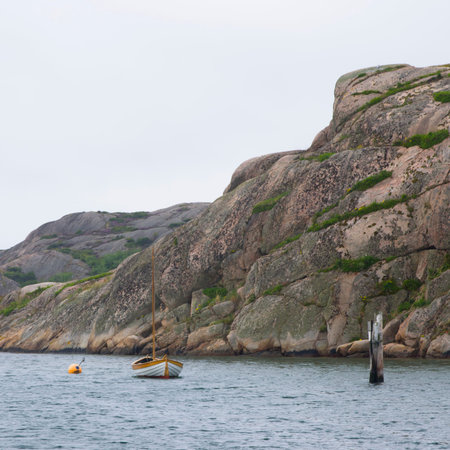 Sailboat at anchor on archipelago coastの写真素材