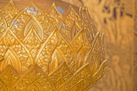 Buddhist golden pattern sculpture in public temple Chiang mai northern thailand, Vintage wame tone colorful filtered with blur lai thai backgroundの写真素材