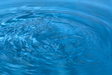 Water drop and bubble blue background