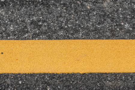 Asphalt road texture with yellow lineの写真素材