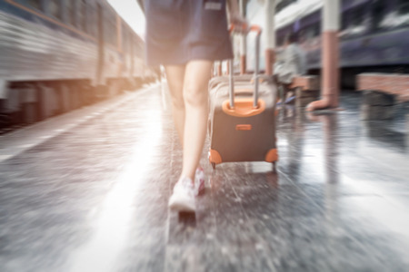 Close up traveling people woman at the railway station in motion blurの写真素材