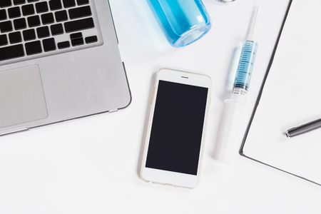 Doctor desk top view, mobile screen copy space.の写真素材