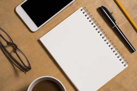 Office desk with accessories and paper for insert your textの写真素材